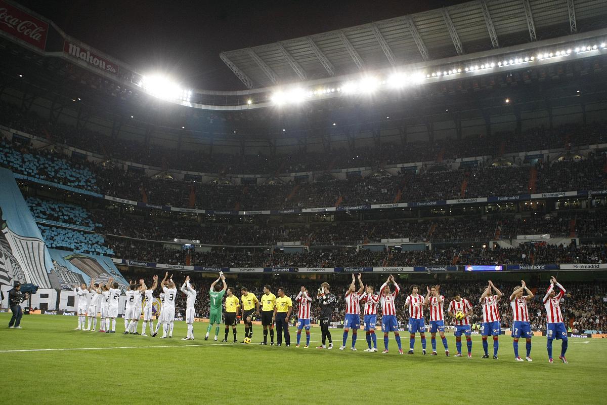 包含马德里竞技险胜对手，球队凭借实力取胜，进军下一轮的词条